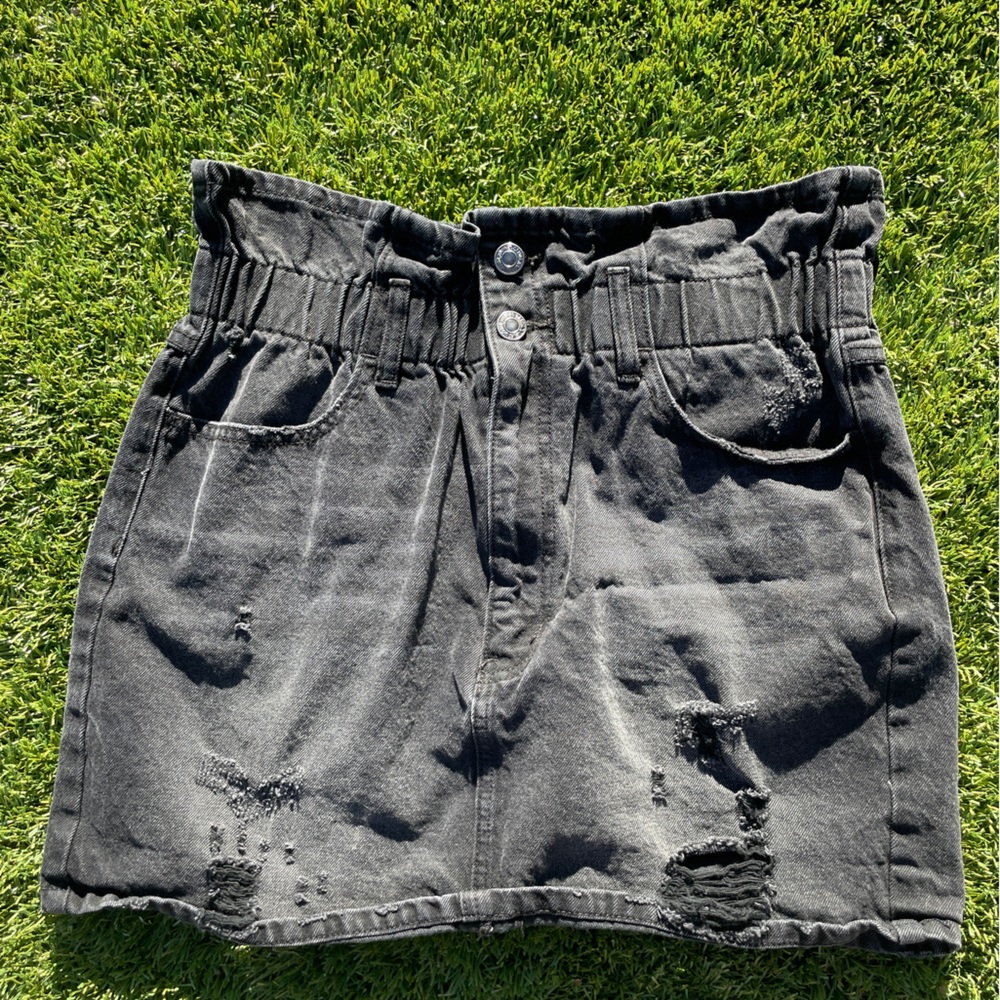 Black jean skirt. Size medium. Stretchy